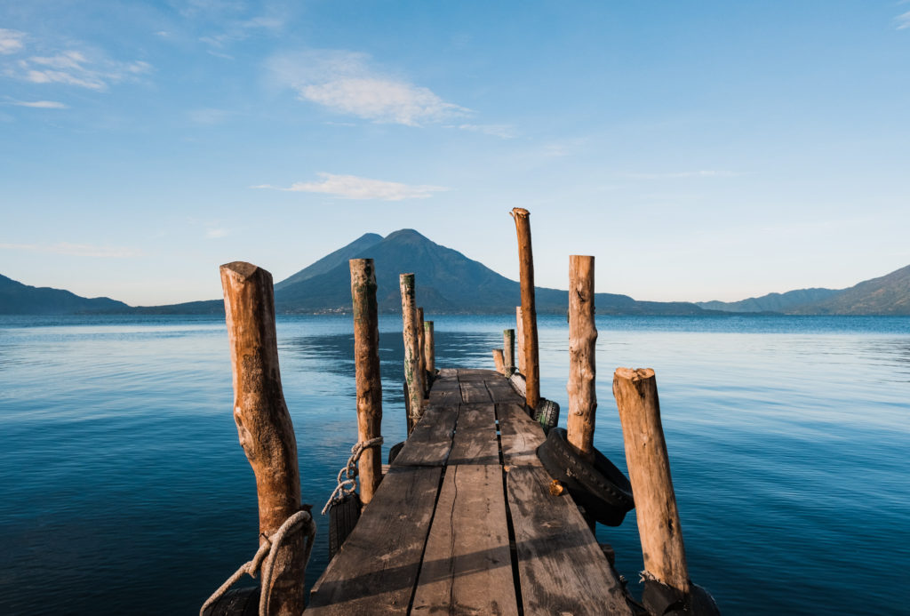 Wooden dock at sunrise on Lake Atitlan Guatemala