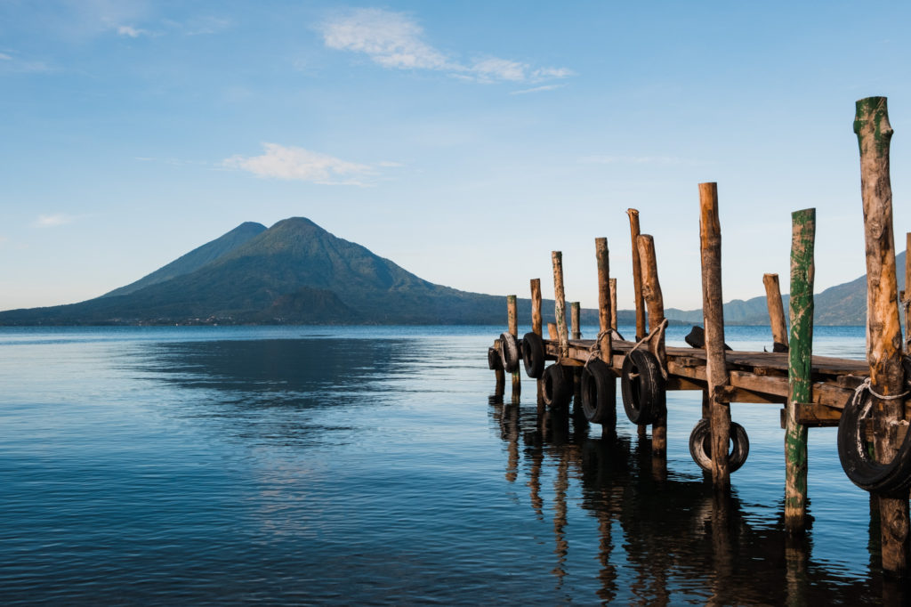 Wooden dock at sunrise on Lake Atitlan Guatemala